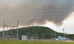 La fumée d’un feu de forêt recouvre le ciel près de Churchill Falls, au centre du Labrador, le 19 juin 2024.